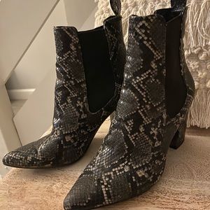 Snakeskin Steve Madden pointed toe boot.